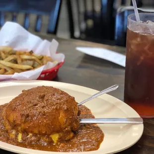 Cheeseburger with chili, Spanish fries and iced tea