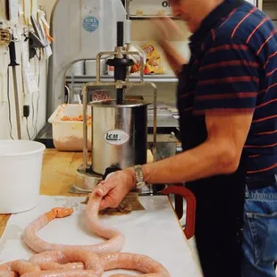 a man preparing sausages