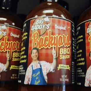 three bottles of barbecue sauce