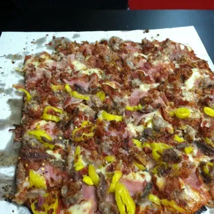 Heartattack Pizza with banana peppers &amp; anchovies on my half.