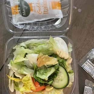 a salad in a plastic container
