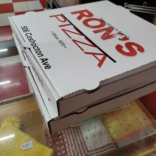 a box of pizza on a counter