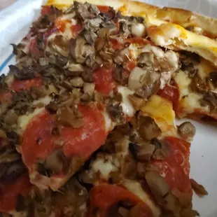 a slice of pizza on a plate