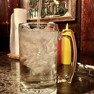 a glass of water with ice