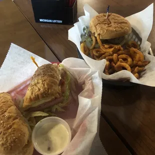 Burger and a slim John with curly fries