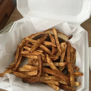 So many fries it covered the sandwich!