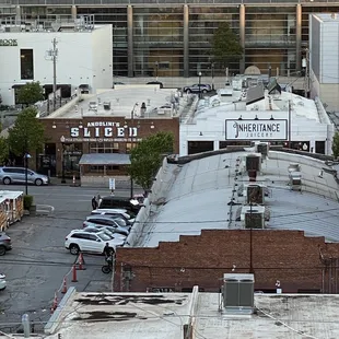 a view of a parking lot with a large building in the background