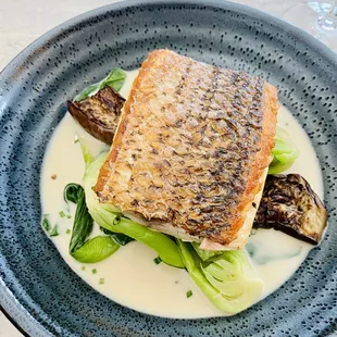 a plate of fish and vegetables