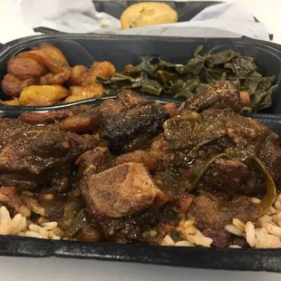 Oxtails, greens, and fired plantains.