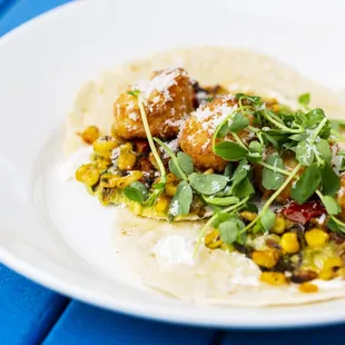 a plate of food on a blue table