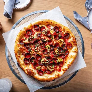 Meet THE PEP  - where crispy pepperoni, tangy pepperoncini, and a drizzle of hot honey create a perfect rooftop rendezvous.