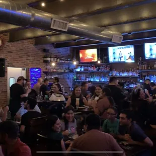 a large group of people at a bar