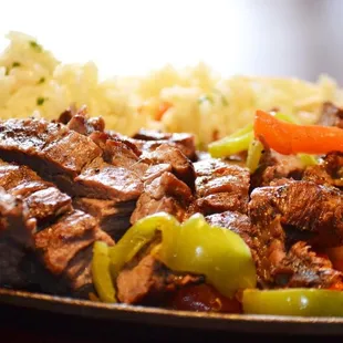 a plate of meat and vegetables