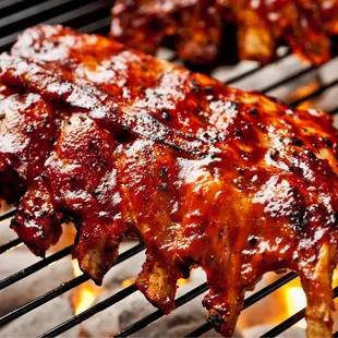 barbecued ribs on a grill