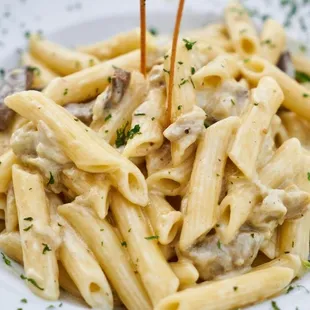 a plate of pasta with mushrooms