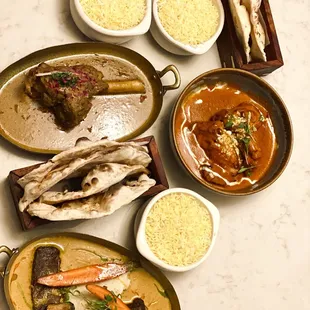 Butter Chicken, Short Rib Curry, Lamb Shank Nihari, Garlic Naan, Rice