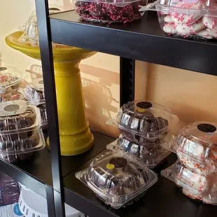 a shelf of cookies and pastries