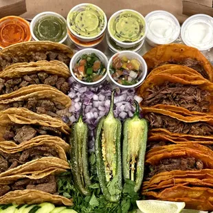 a box full of tacos and vegetables