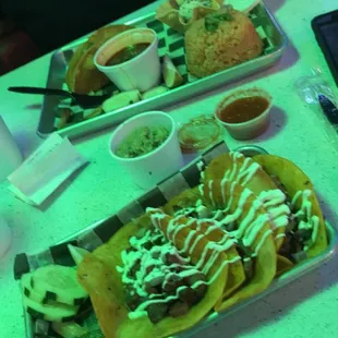 Tacos Locos, and chicken tacos with the best rice and beans side. Good chips, great guacamole and salsa. Extra sour cream. Mmm!