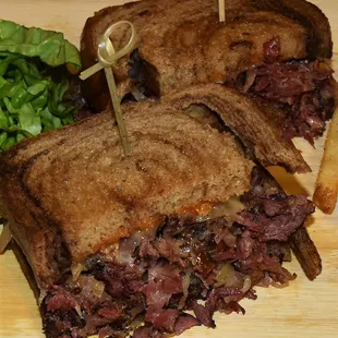  cut in half sandwich on a cutting board