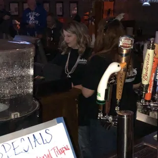 a woman serving beer