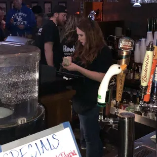 a woman pouring beer