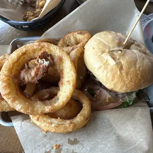 Veggie mushroom swiss burger with onion rings.