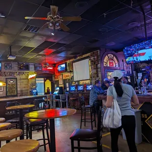 a woman standing at the bar