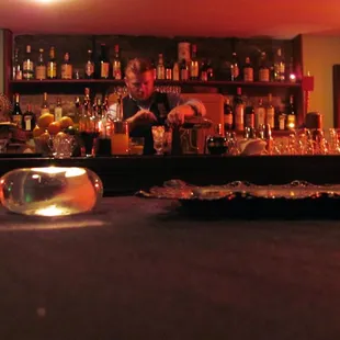 a bar with many bottles of alcohol