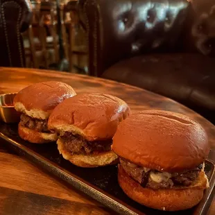 a tray of hamburgers on a table