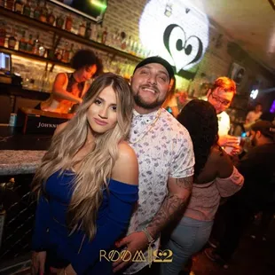 a man and a woman at a bar