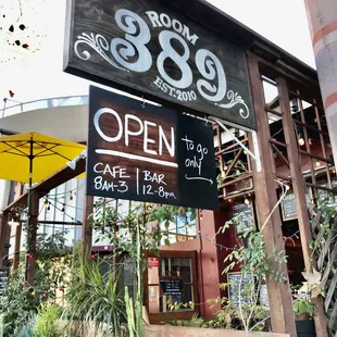open sign in front of restaurant