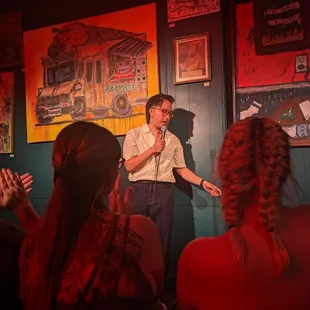 a man speaking to a group of people