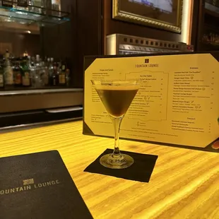a cocktail in a martini glass