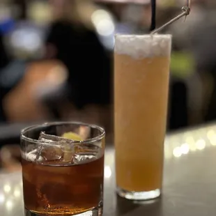 a drink and a beverage on a bar