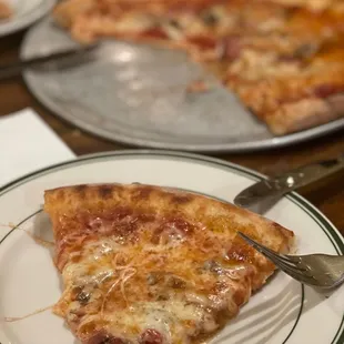 a slice of pizza on a plate