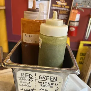 a container of sauces and condiments