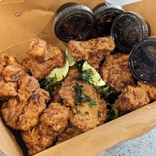 12 pieces thighs and drums a la carte. Fried fresh to order. The soy ginger dipping sauce is the bomb.