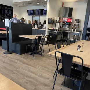 No counter space in self-service drink station. Storage bins.