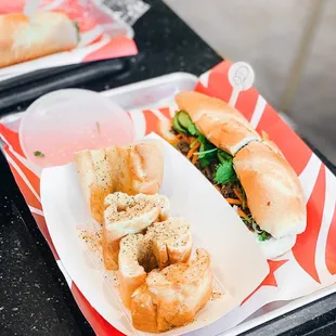 Roostar Garlic Bread and Grilled Pork Banh Mi | IG: @joyyeats