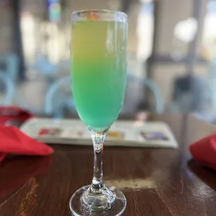a green drink in a glass