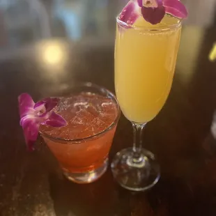 a glass of mimosa and a glass of orange juice