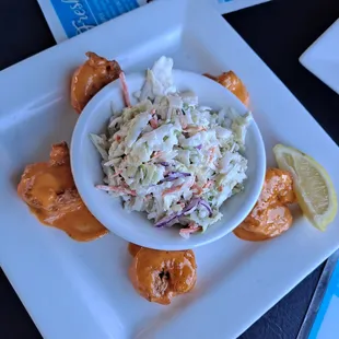 a bowl of coleslaw and pretzels