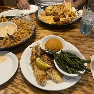 Captain&apos;s platter, onion straws, blackened catfish with mashed sweet potatoes and green beans.