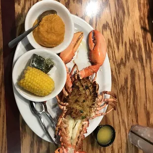 a lobster, corn, and corn on the cob