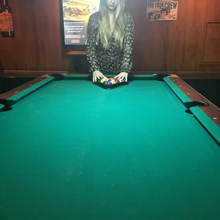 a woman playing pool