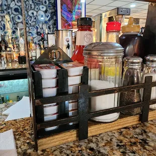 a counter with a variety of condiments