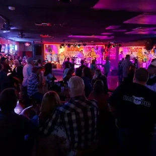 a crowd of people in a bar