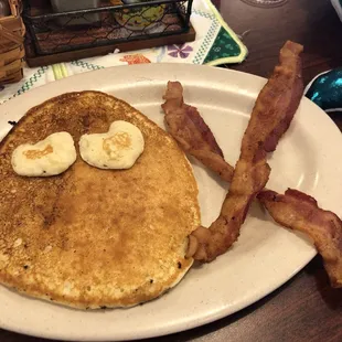 a plate of pancakes and bacon