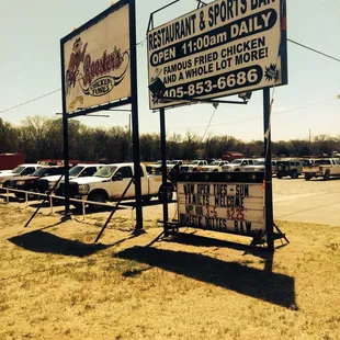 a sign for a restaurant and sports bar